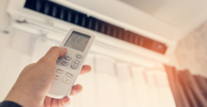 Using the remote control to open the air conditioning unit | Gibber Services