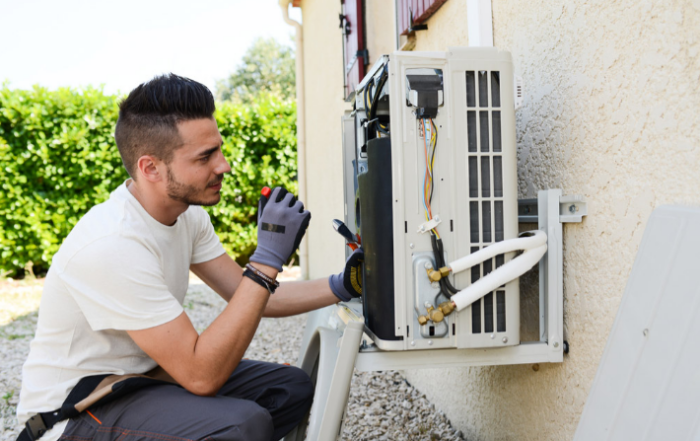 A person who checks the air conditioning unit to keep it running smoothly | Gibber Services