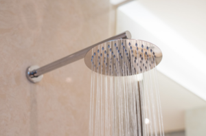 A turned-on shower that makes a squealing sound